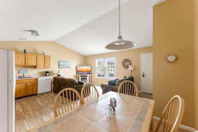 328 E 25th Ave Unit C, North Wildwood, NJ 08260 - dining space with vaulted ceiling and light wood-type flooring