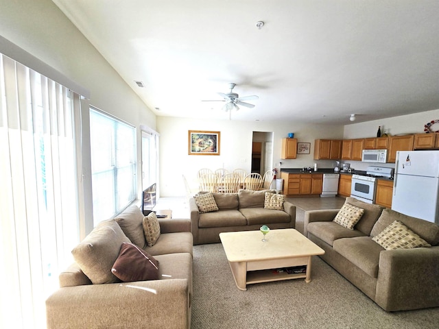 living room featuring ceiling fan