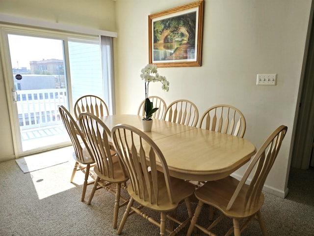 dining area with carpet and a healthy amount of sunlight