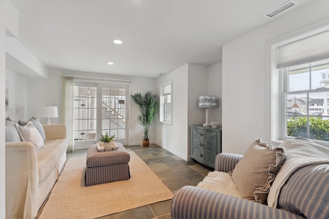 living room featuring plenty of natural light