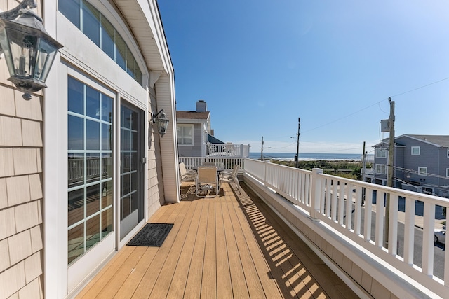 bird's eye view featuring a water view and a beach view