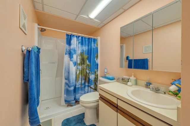 bathroom featuring vanity, toilet, curtained shower, and tile patterned flooring