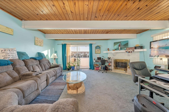 carpeted living room with beamed ceiling, wood ceiling, and a tiled fireplace