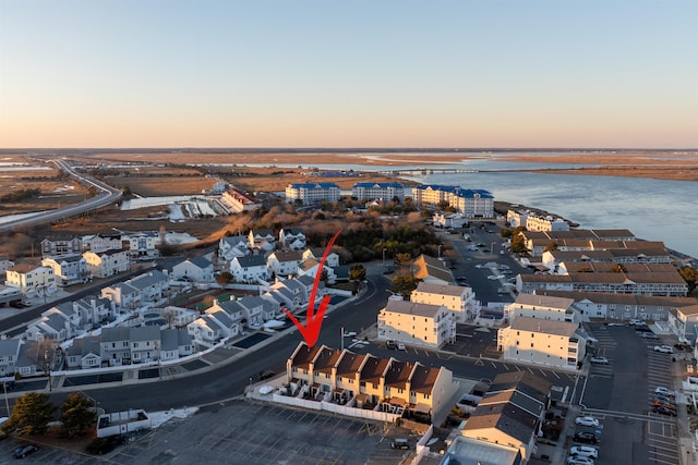 aerial view at dusk with a water view