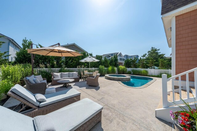 56 E 22nd St, Avalon, NJ 08202 - fenced backyard with an outdoor living space, a patio area, and a pool with connected hot tub