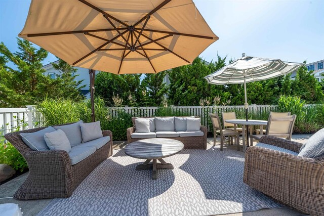 56 E 22nd St, Avalon, NJ 08202 - fenced backyard featuring an outdoor hangout area, outdoor dining space, and a patio