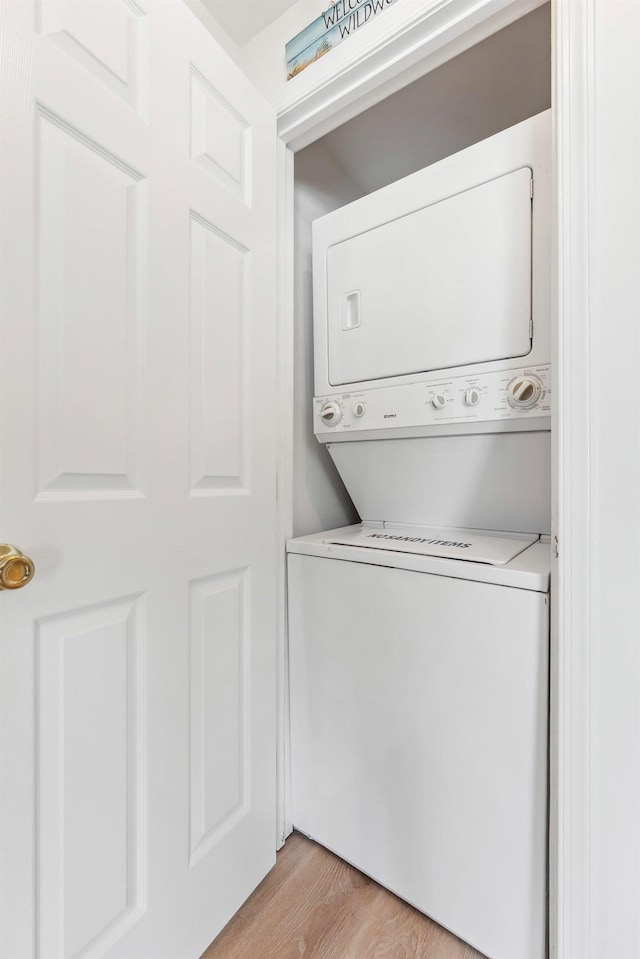 316 E 17th Ave Unit 6, North Wildwood, NJ 08260 - laundry room featuring stacked washer and clothes dryer and light wood-style floors