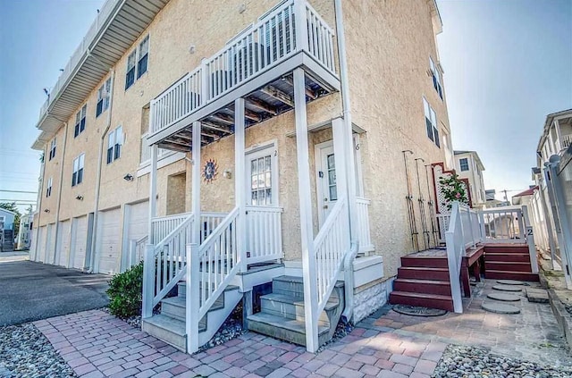 316 E 17th Ave Unit 6, North Wildwood, NJ 08260 - view of exterior entry featuring stucco siding and a balcony