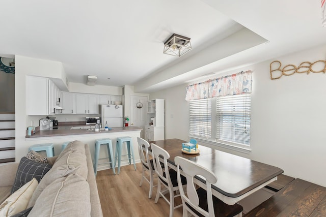 316 E 17th Ave Unit 6, North Wildwood, NJ 08260 - dining area with light wood-type flooring