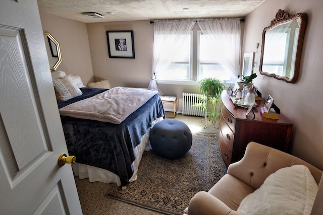 14 Lyndhurst Rd, Marmora, NJ 08223 - bedroom with radiator heating unit, carpet floors, and a textured ceiling