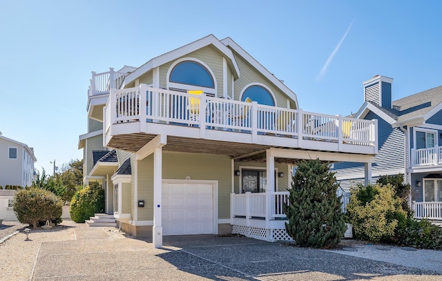 138 8th St, Avalon, NJ 08202 - view of front facade with an attached garage and driveway