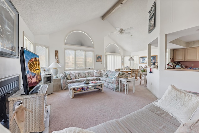 138 8th St, Avalon, NJ 08202 - carpeted living area featuring beam ceiling, a ceiling fan, and high vaulted ceiling