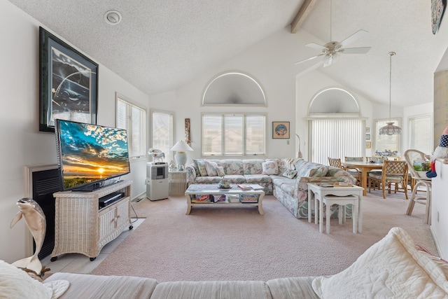 138 8th St, Avalon, NJ 08202 - living area featuring light carpet, beam ceiling, high vaulted ceiling, ceiling fan, and a textured ceiling