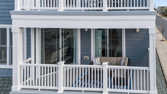 exterior space featuring a balcony and a deck