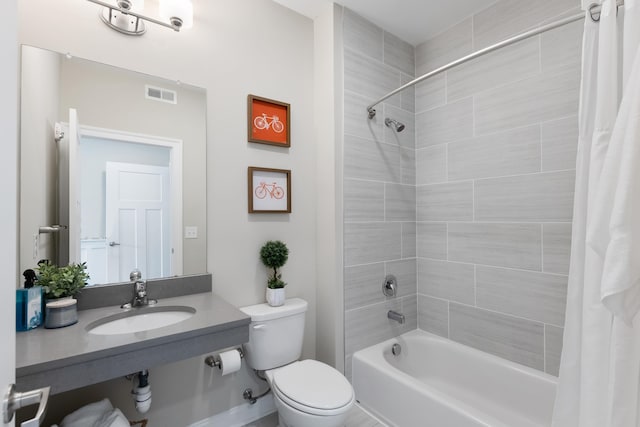 full bathroom with shower / tub combo, toilet, and sink