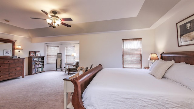 bedroom with ceiling fan and light colored carpet