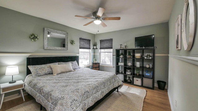 bedroom featuring ceiling fan and hardwood / wood-style floors