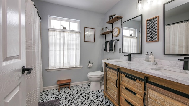 bathroom with tile patterned floors, toilet, and vanity