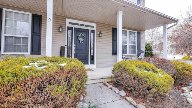 doorway to property featuring a porch