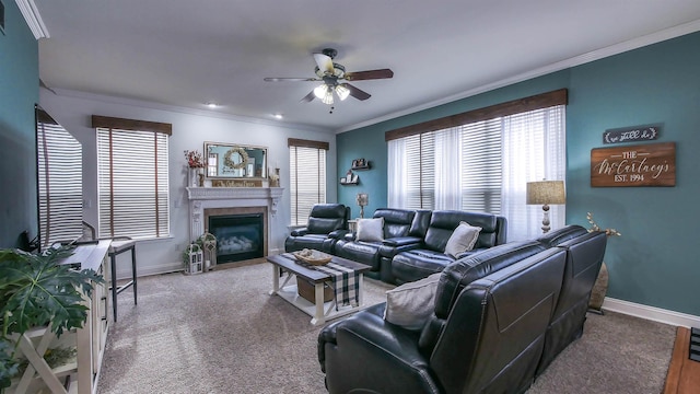 carpeted living room featuring ceiling fan and ornamental molding