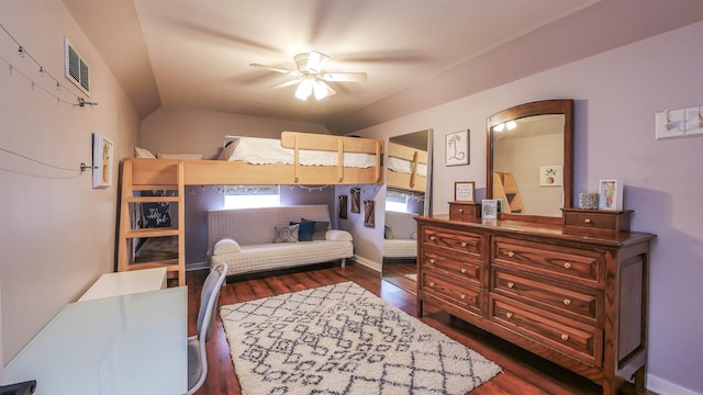 bedroom with ceiling fan, dark hardwood / wood-style floors, and lofted ceiling