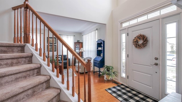 entryway with hardwood / wood-style flooring