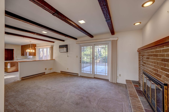 unfurnished living room with a baseboard heating unit, a wall mounted AC, beamed ceiling, and a brick fireplace