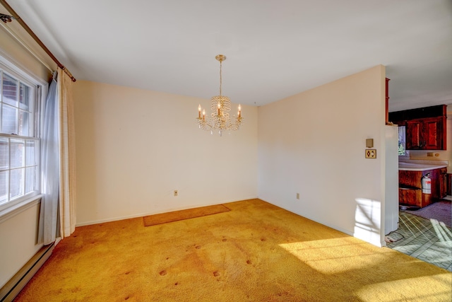 unfurnished dining area with a baseboard heating unit, a chandelier, and carpet flooring