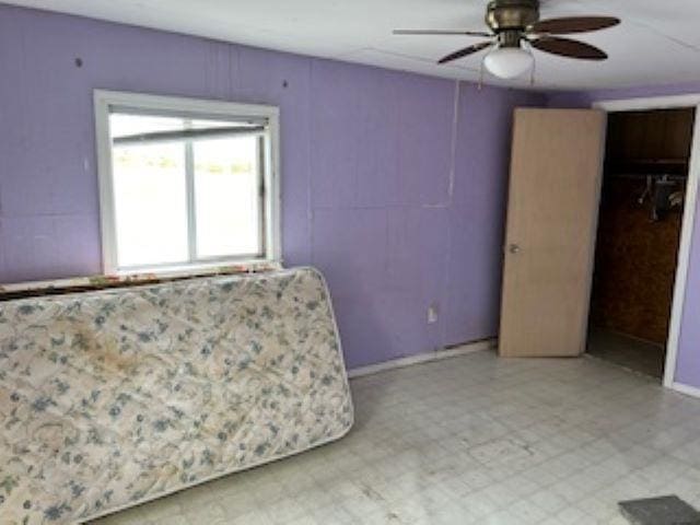 unfurnished room with ceiling fan