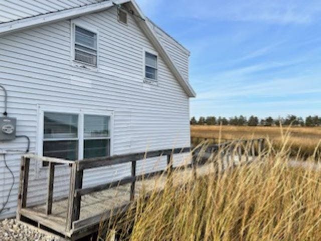 view of property exterior featuring a deck