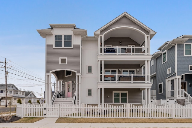 200 W 8th Ave, North Wildwood, NJ 08260 - view of front of property featuring a gate, a fenced front yard, a porch, and a balcony