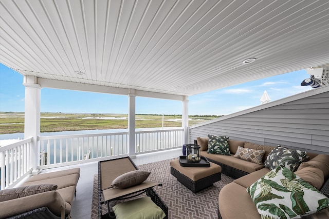 3328 Ocean Dr Unit 3328, Avalon, NJ 08202 - sunroom featuring an outdoor hangout area, a water view, and healthy amount of natural light