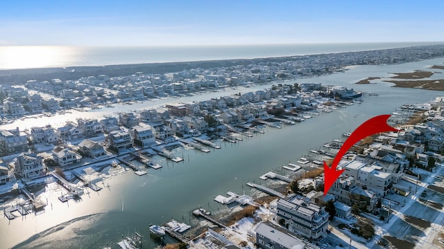 birds eye view of property featuring a water view