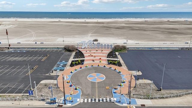 bird's eye view with a beach view and a water view