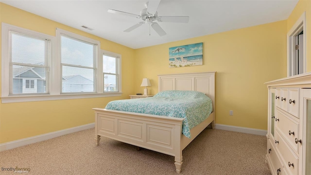 bedroom with light carpet and ceiling fan