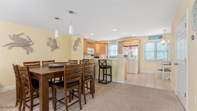 view of carpeted dining area