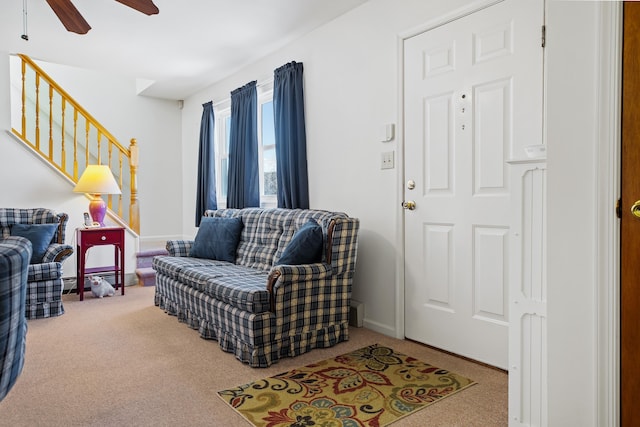 living room with carpet floors and ceiling fan