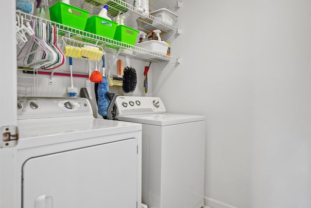 washroom with independent washer and dryer