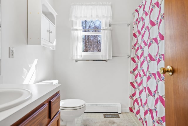 bathroom featuring vanity, toilet, walk in shower, and a baseboard radiator