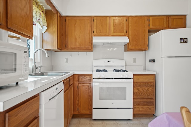 kitchen featuring sink and white appliances