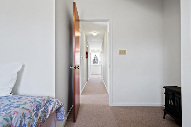 bedroom featuring light colored carpet