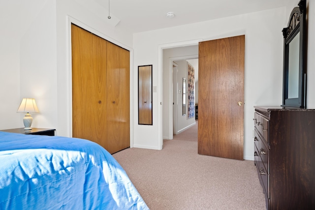 carpeted bedroom featuring a closet