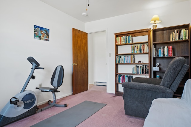 workout area with light carpet and a baseboard radiator