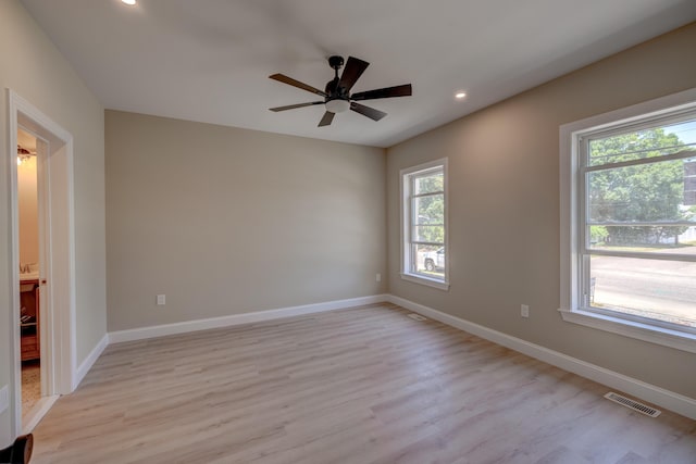 unfurnished room featuring ceiling fan and light hardwood / wood-style floors