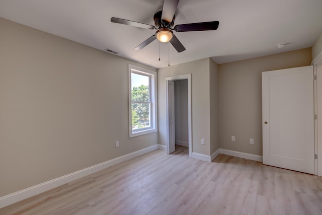 unfurnished bedroom featuring light hardwood / wood-style flooring and ceiling fan