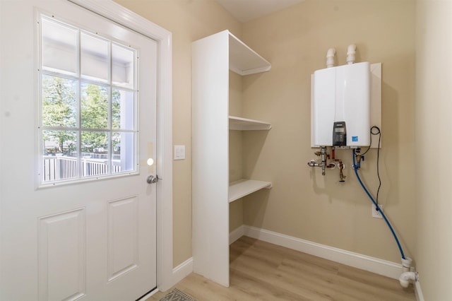 entryway featuring light hardwood / wood-style flooring and water heater