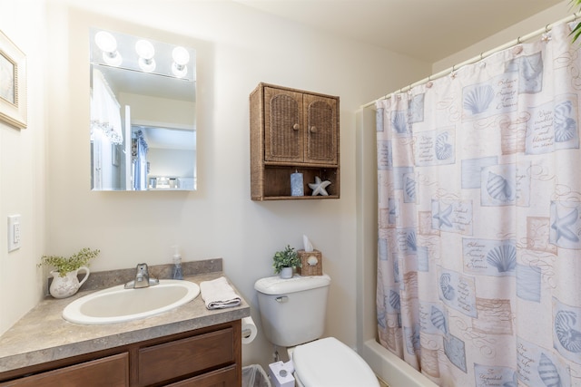 bathroom featuring vanity, toilet, and curtained shower