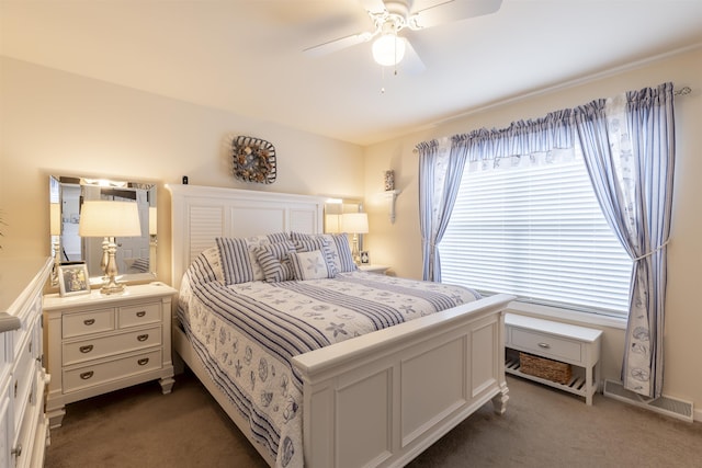 bedroom featuring dark colored carpet and ceiling fan