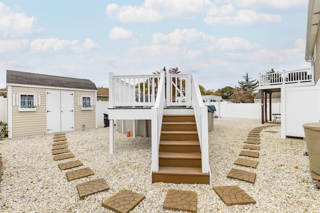 exterior space with a wooden deck and a shed