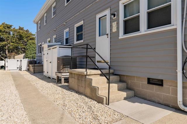 9903 2nd Ave, Stone Harbor, NJ 08247 - view of home's exterior with crawl space, fence, and a gate